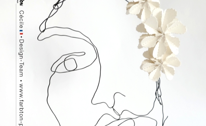 DT Farbton Papier : Un visage en fil de fer et fleurs en papier.